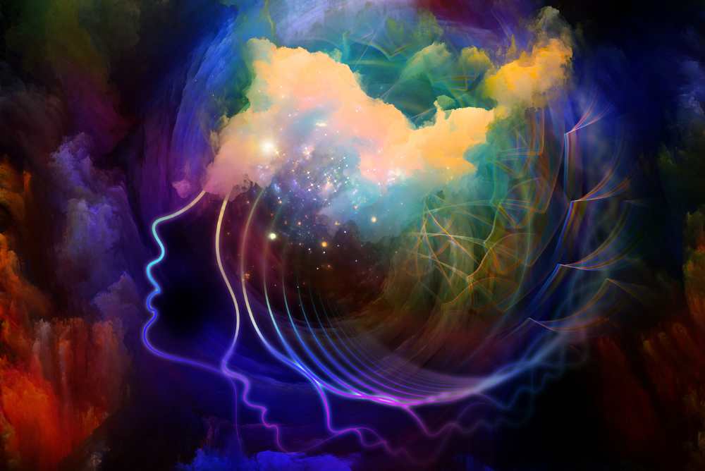 Colourful graphic of brain drain showing colours radiating from a person's head